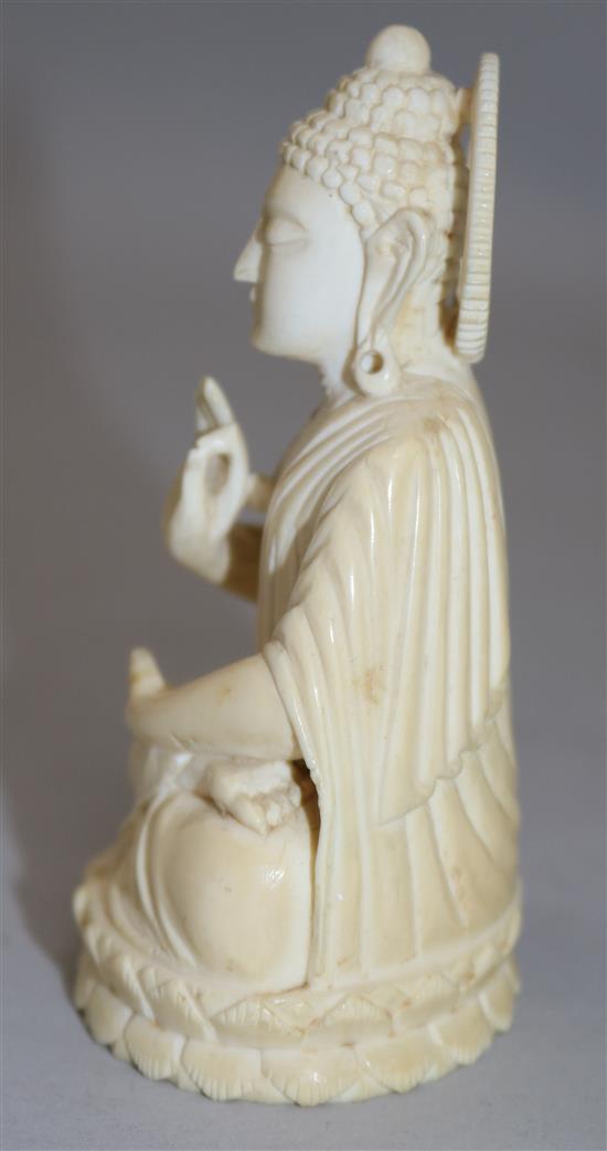 A Chinese ivory seated figure of Buddha Shakyamuni, early 20th century, 11cm